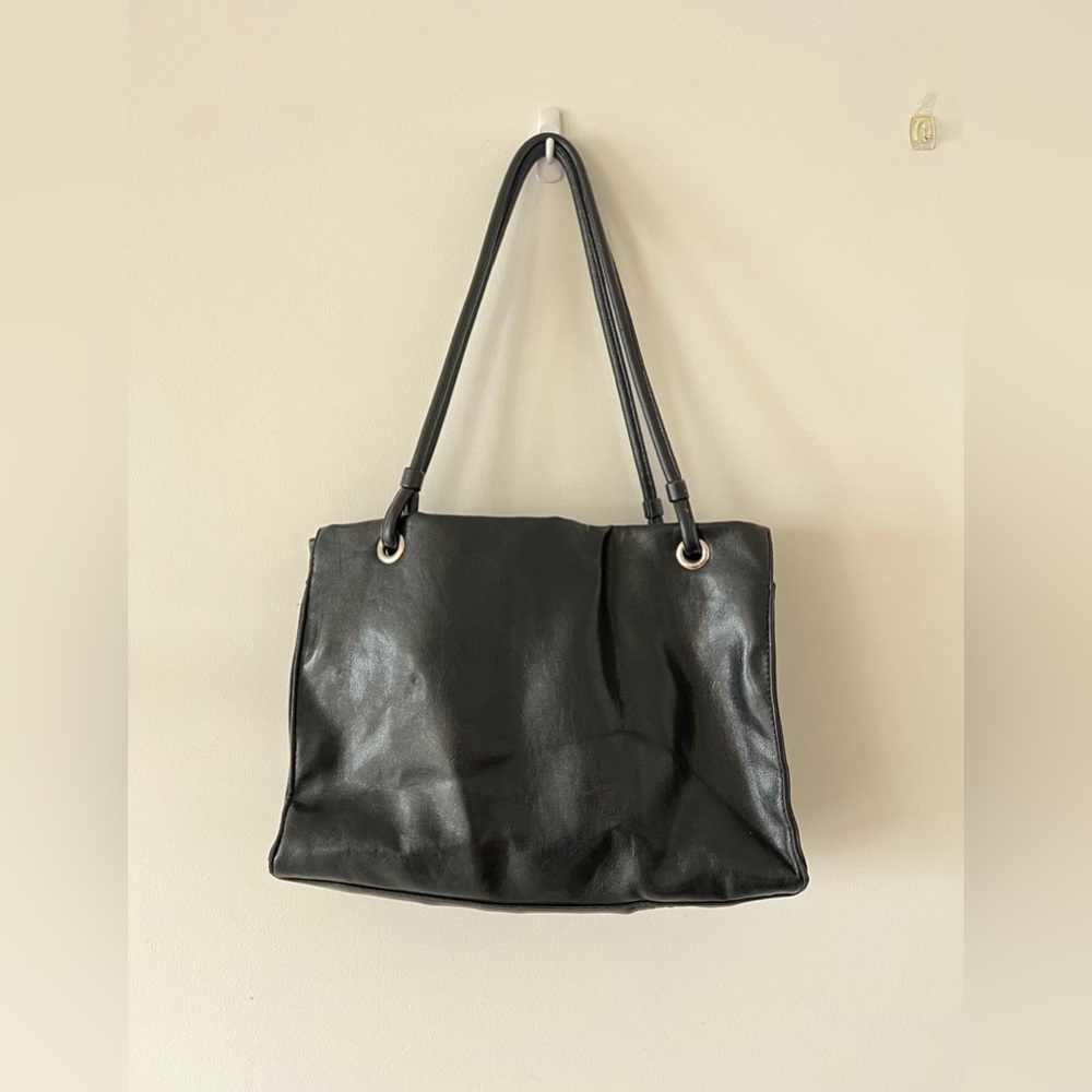 Woman’s black shoulder purse